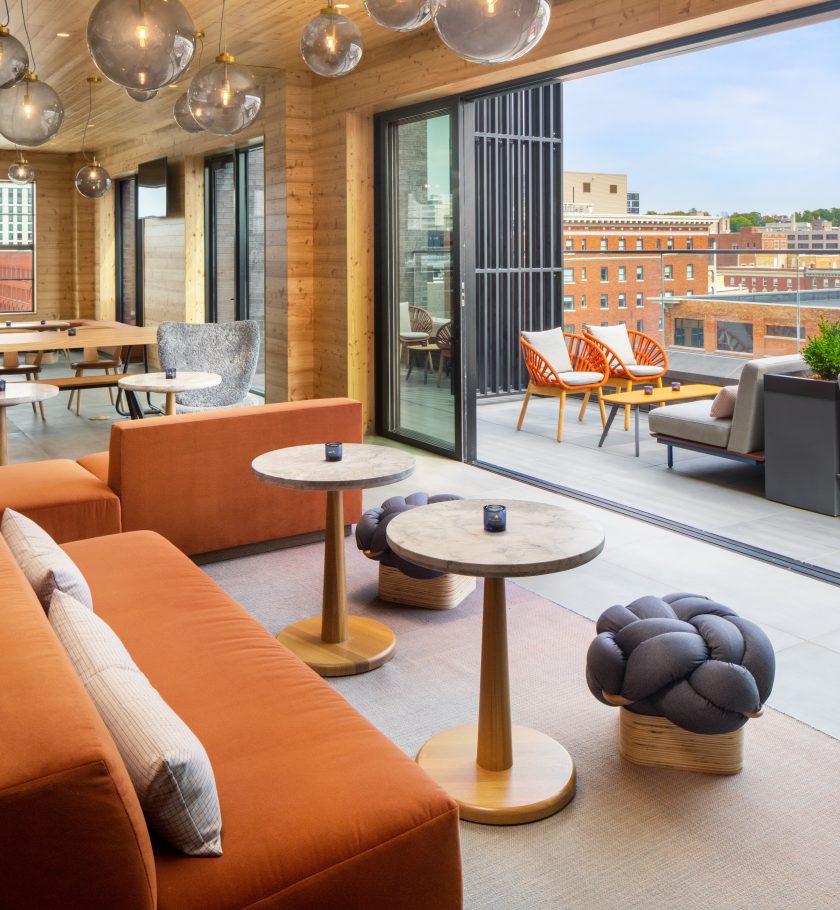 Casual indoor dining area with large doors to rooftop patio